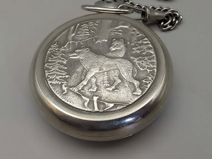 Molnija pocket watch with 'Wolves in the Forest' engraving, nickel-plated brass, silver-tone, circa 1980s, Soviet Union origin.