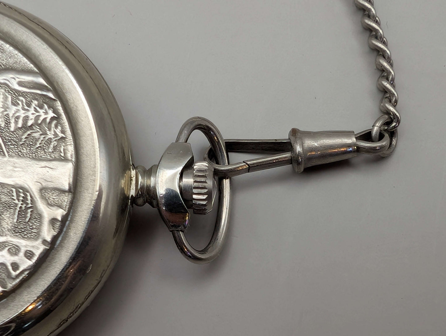 Vintage Molnija pocket watch with 'Wolves in the Forest' engraving, silver-tone, circa 1980s, showing detailed chain and clasp.